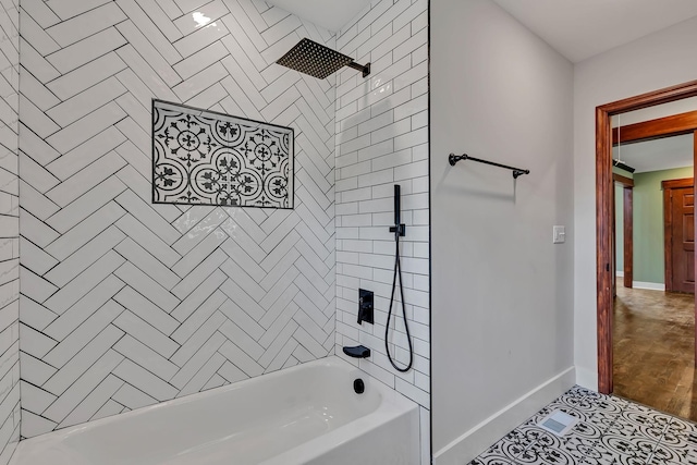 full bathroom featuring baseboards and washtub / shower combination