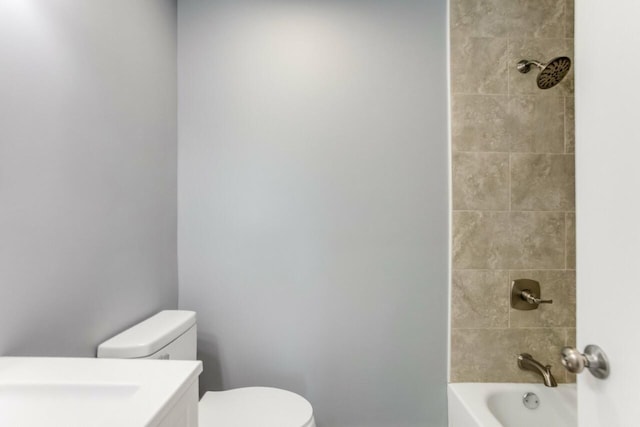 bathroom with vanity, toilet, and tub / shower combination