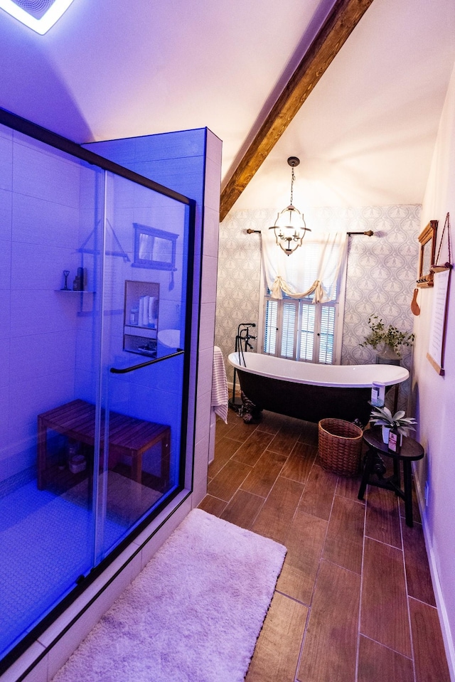 full bath featuring a chandelier, beamed ceiling, a shower stall, wood finished floors, and wallpapered walls