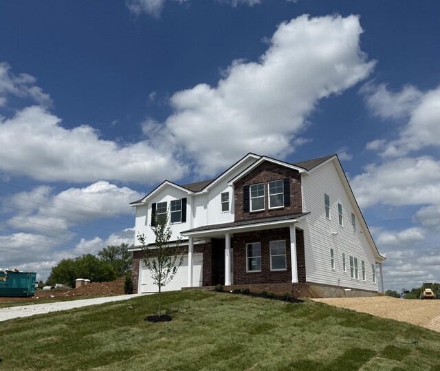203 Boson Ct, Columbia, TN 38401 - traditional-style house featuring a garage, brick siding, and a front yard
