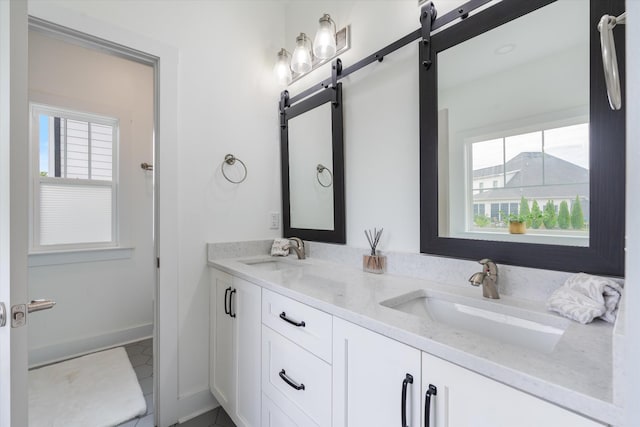 22 Flip Flop Ct, Winchester, TN 37398 - bathroom featuring tile patterned floors, baseboards, a sink, and double vanity