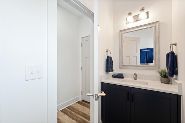 22 Flip Flop Ct, Winchester, TN 37398 - bathroom featuring baseboards, vanity, and wood finished floors