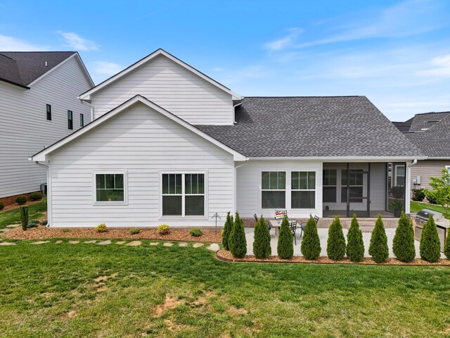 22 Flip Flop Ct, Winchester, TN 37398 - rear view of house featuring a lawn, a sunroom, and a shingled roof