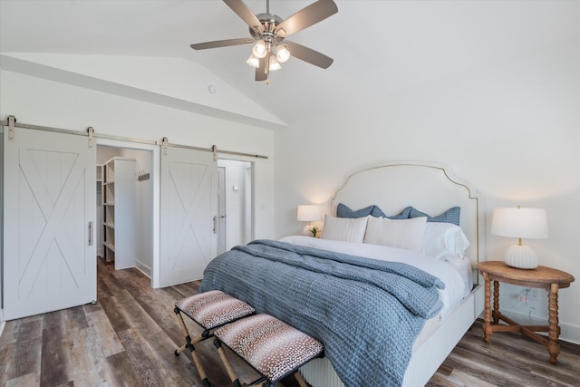 22 Flip Flop Ct, Winchester, TN 37398 - bedroom with a barn door, vaulted ceiling, wood finished floors, a walk in closet, and baseboards