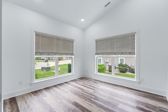 22 Flip Flop Ct, Winchester, TN 37398 - spare room featuring baseboards, wood finished floors, visible vents, and high vaulted ceiling