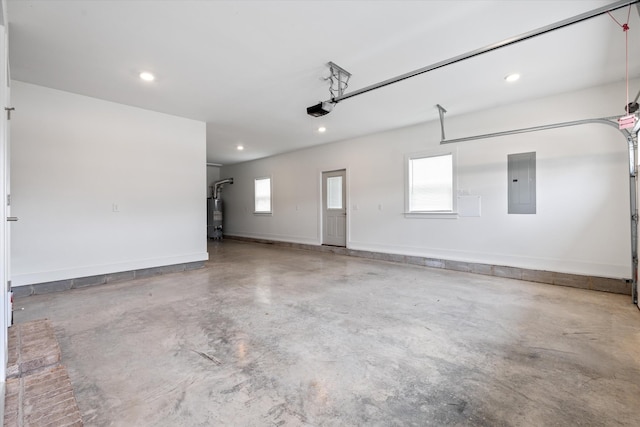 22 Flip Flop Ct, Winchester, TN 37398 - garage featuring electric panel, gas water heater, baseboards, recessed lighting, and a garage door opener