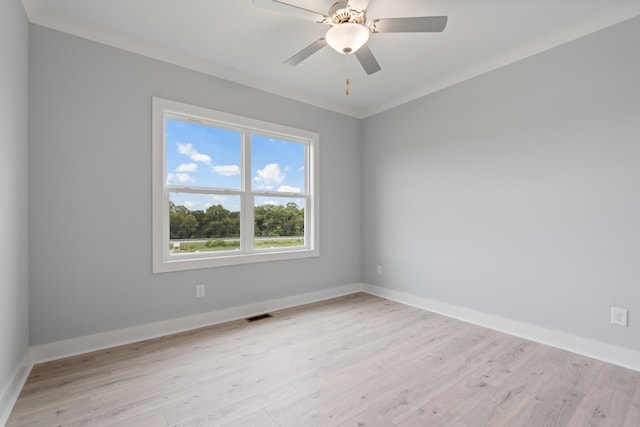 empty room with visible vents, baseboards, a ceiling fan, and light wood-style floors
