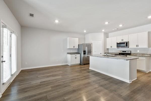 kitchen featuring white cabinetry, appliances with stainless steel finishes, recessed lighting, and dark wood-type flooring