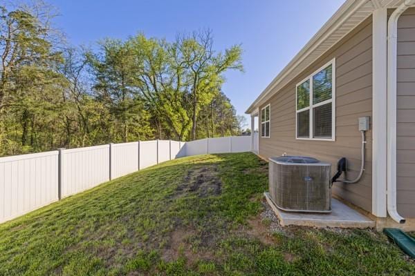 view of yard featuring a fenced backyard and cooling unit