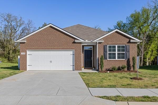 ranch-style home with an attached garage, concrete driveway, a front lawn, and brick siding