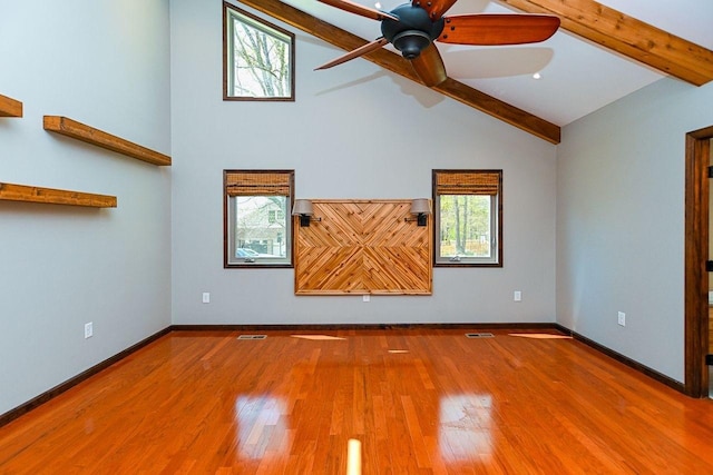 empty room with baseboards, a ceiling fan, visible vents, beam ceiling, and high vaulted ceiling