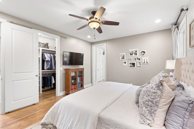 4008 Nevada Ave, Nashville, TN 37209 - bedroom featuring ceiling fan, light wood-type flooring, a closet, recessed lighting, and a walk in closet