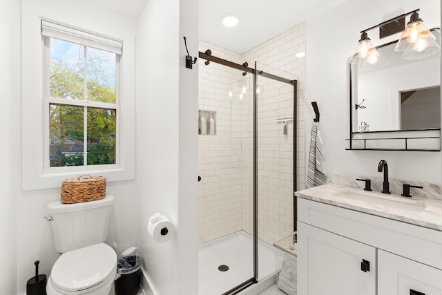4008 Nevada Ave, Nashville, TN 37209 - full bathroom with toilet, a shower stall, vanity, and baseboards