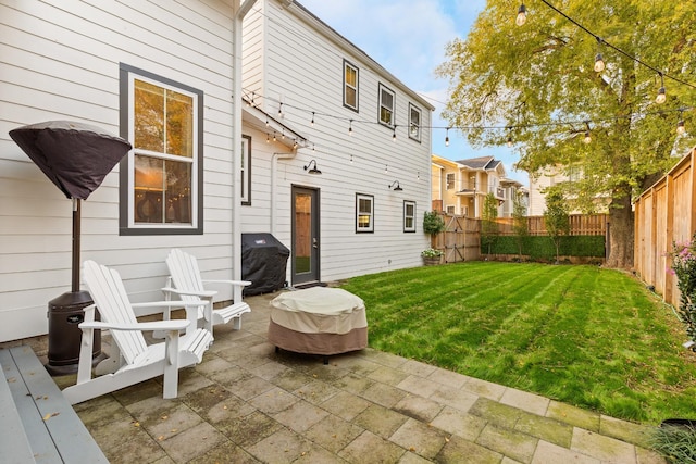 4008 Nevada Ave, Nashville, TN 37209 - back of house featuring a patio, a fenced backyard, and a lawn