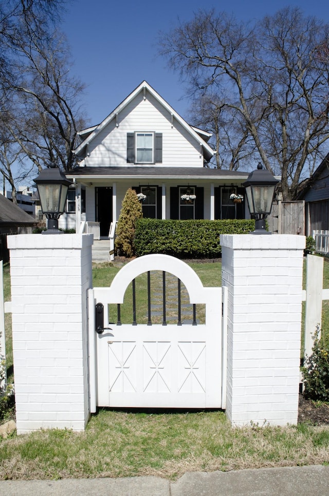 4008 Nevada Ave, Nashville, TN 37209 - view of front facade featuring a porch, a gate, and a fenced front yard