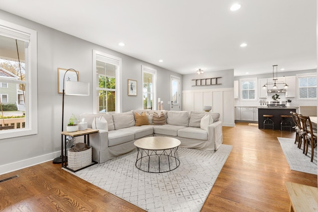 4008 Nevada Ave, Nashville, TN 37209 - living room featuring light wood finished floors, baseboards, visible vents, and recessed lighting