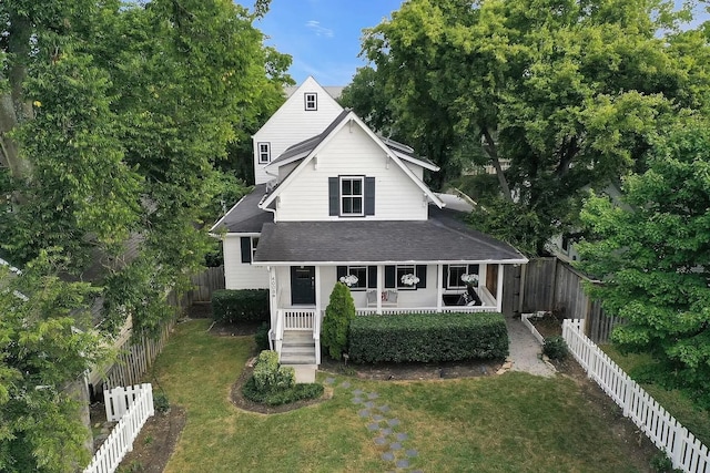 4008 Nevada Ave, Nashville, TN 37209 - view of front facade featuring a fenced backyard, a front lawn, roof with shingles, and a porch