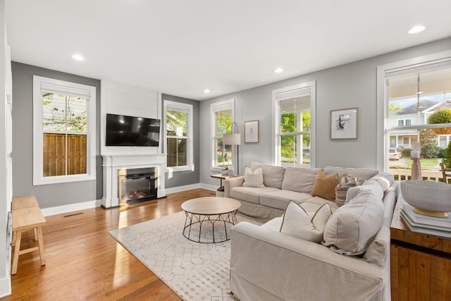 4008 Nevada Ave, Nashville, TN 37209 - living room featuring wood finished floors, recessed lighting, and a healthy amount of sunlight
