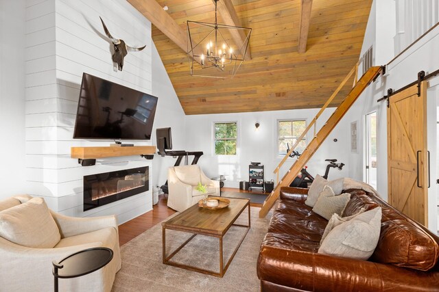 4008 Nevada Ave, Nashville, TN 37209 - living area with wooden ceiling, a barn door, a chandelier, wood finished floors, and a glass covered fireplace