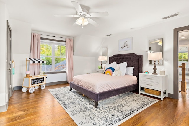 4008 Nevada Ave, Nashville, TN 37209 - bedroom with visible vents, baseboards, vaulted ceiling, and wood finished floors