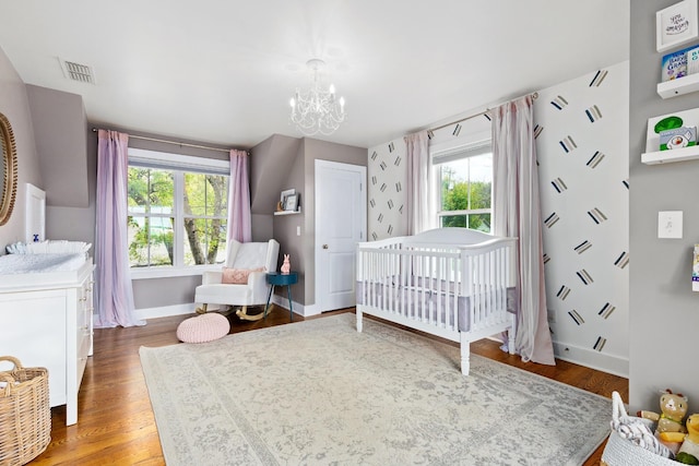4008 Nevada Ave, Nashville, TN 37209 - bedroom featuring a chandelier, baseboards, multiple windows, and visible vents