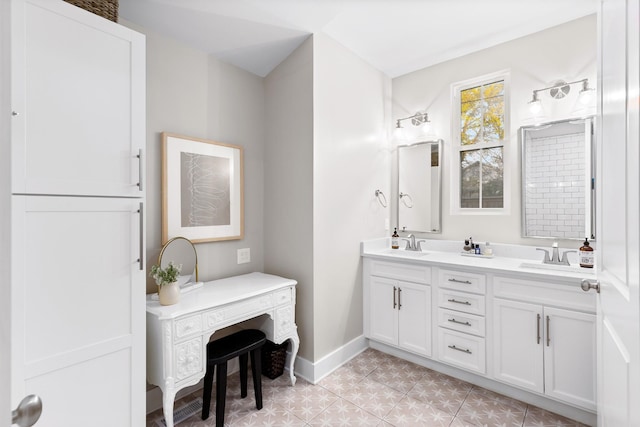 4008 Nevada Ave, Nashville, TN 37209 - bathroom featuring tile patterned floors, double vanity, a sink, and baseboards