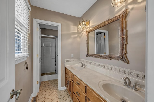 bathroom featuring double vanity, visible vents, a sink, and a stall shower