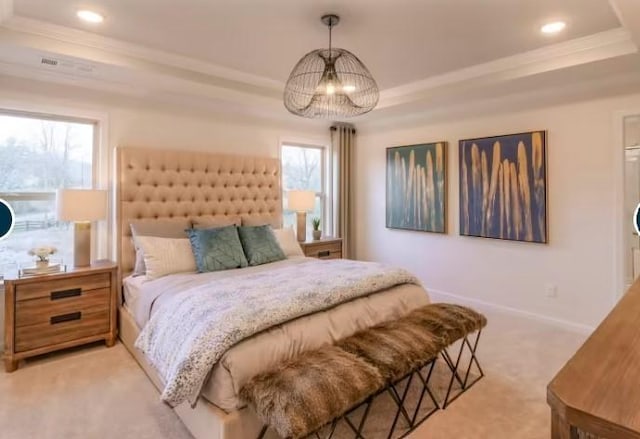 bedroom with multiple windows, light colored carpet, baseboards, and a raised ceiling