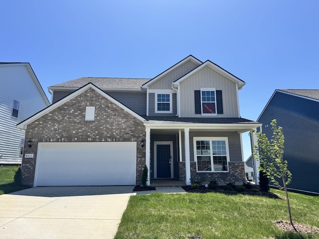 traditional-style house with a garage, covered porch, a front lawn, brick siding, and driveway