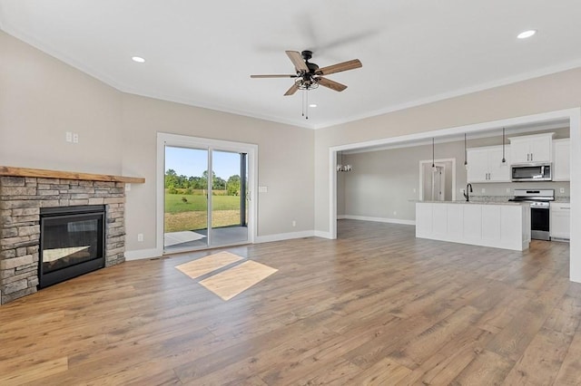 2717 Autumn Woods Trl, Cookeville, TN 38501 - unfurnished living room with a ceiling fan, light wood-style floors, baseboards, crown molding, and recessed lighting