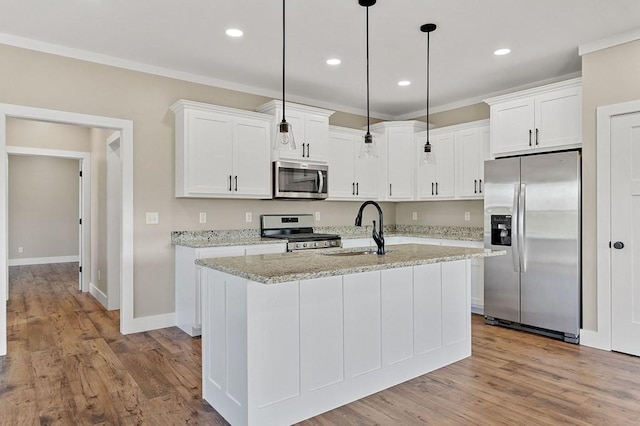 2717 Autumn Woods Trl, Cookeville, TN 38501 - kitchen with stainless steel appliances, a sink, white cabinets, a center island with sink, and pendant lighting