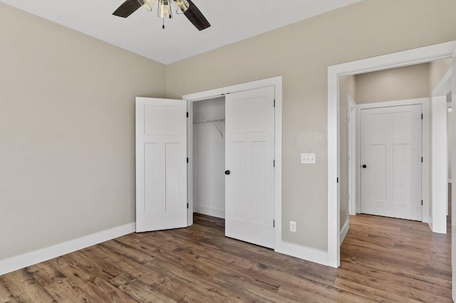 2717 Autumn Woods Trl, Cookeville, TN 38501 - unfurnished bedroom featuring wood finished floors, baseboards, a closet, and ceiling fan