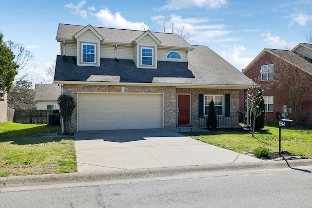 traditional home featuring cooling unit, fence, a front lawn, brick siding, and concrete driveway
