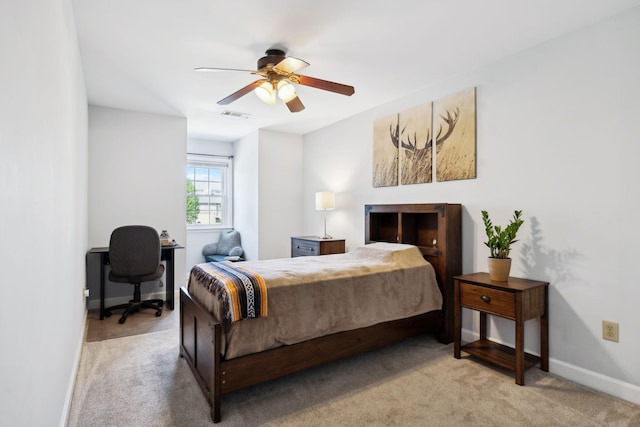 bedroom with light carpet, ceiling fan, baseboards, and visible vents
