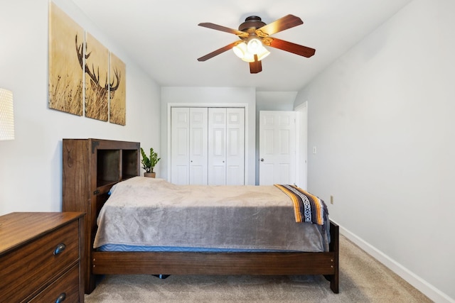 bedroom with a closet, ceiling fan, baseboards, and carpet