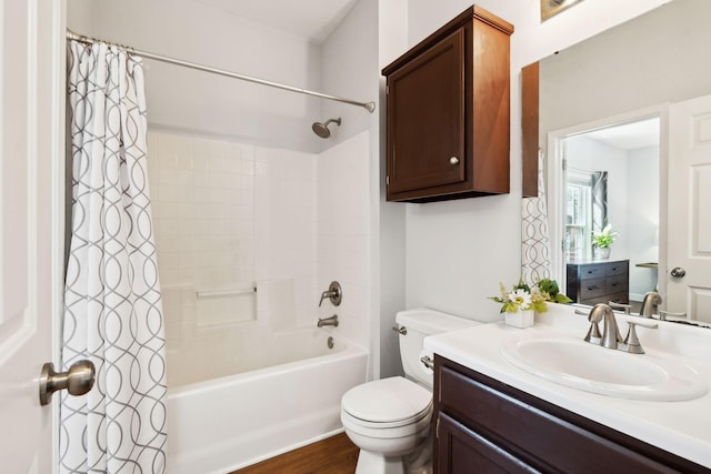 full bathroom with shower / tub combo, vanity, toilet, and wood finished floors
