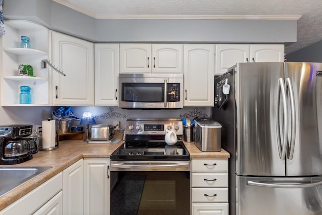 kitchen with white cabinets, open shelves, light countertops, appliances with stainless steel finishes, and a textured ceiling