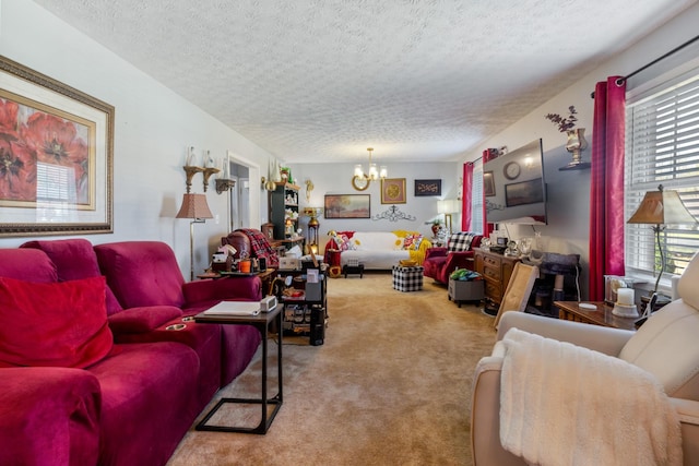 living area with a chandelier, a textured ceiling, and carpet floors