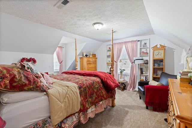 bedroom featuring lofted ceiling, visible vents, a textured ceiling, and carpet floors