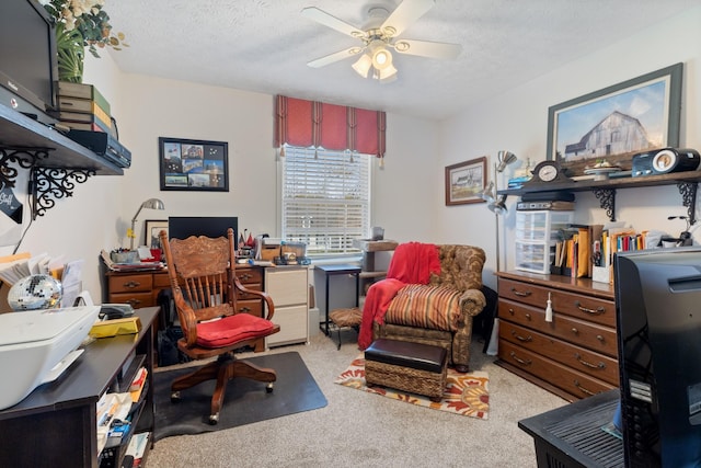 sitting room with light colored carpet, a textured ceiling, and ceiling fan