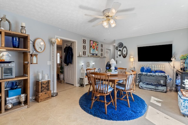 dining room with a ceiling fan