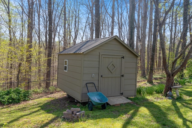 view of shed with fence