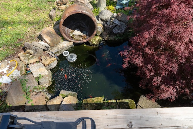 exterior details featuring a small pond