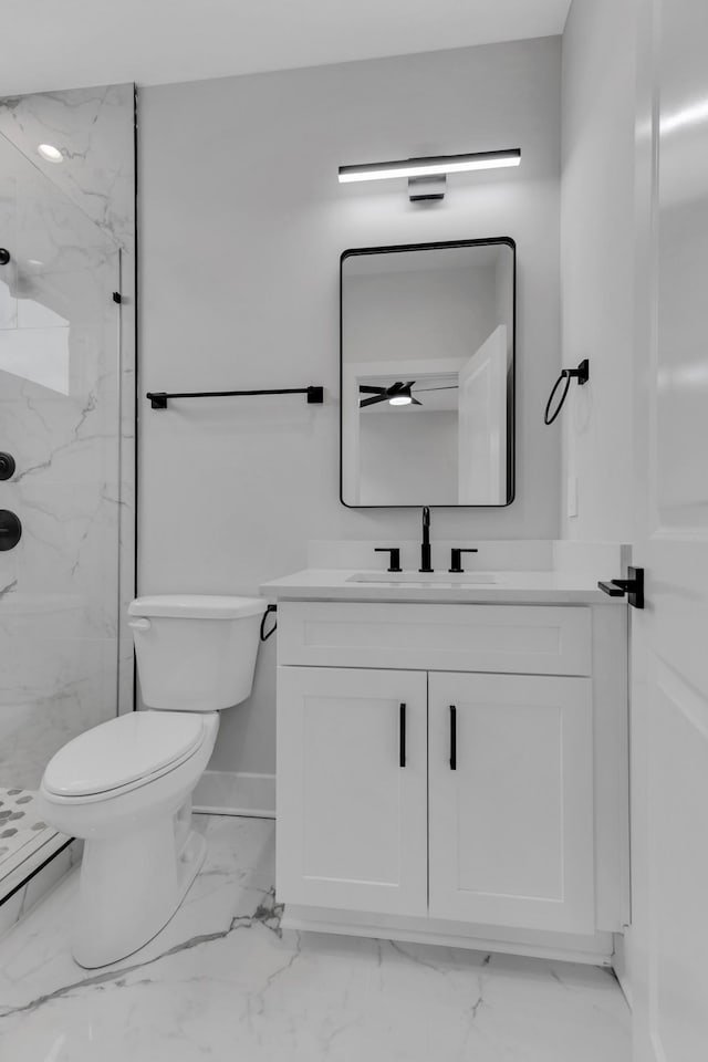 6376A Ivy St, Nashville, TN 37209 - bathroom with vanity, toilet, marble finish floor, a marble finish shower, and baseboards