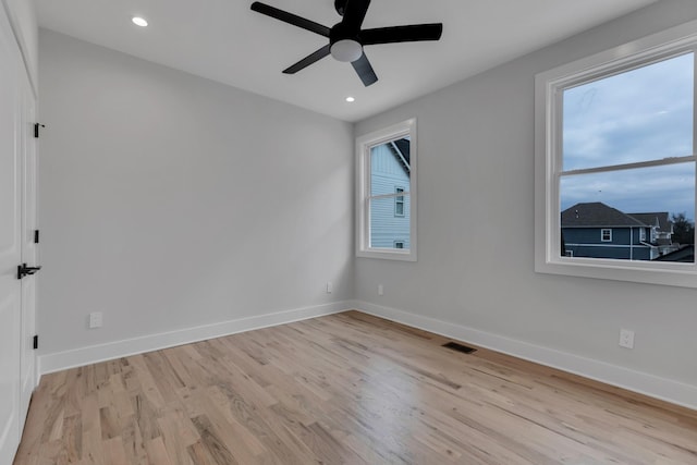 6376A Ivy St, Nashville, TN 37209 - empty room with light wood-style floors, baseboards, and a healthy amount of sunlight