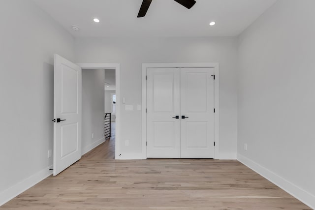 6376A Ivy St, Nashville, TN 37209 - unfurnished bedroom with light wood-style flooring, a closet, baseboards, and a ceiling fan