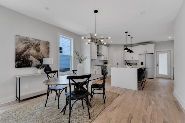6376A Ivy St, Nashville, TN 37209 - dining space with baseboards, light wood-type flooring, a notable chandelier, and recessed lighting