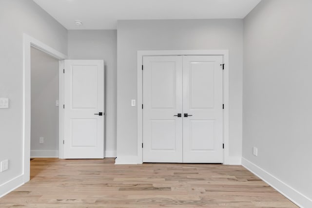 6376A Ivy St, Nashville, TN 37209 - unfurnished bedroom with a closet, light wood finished floors, and baseboards
