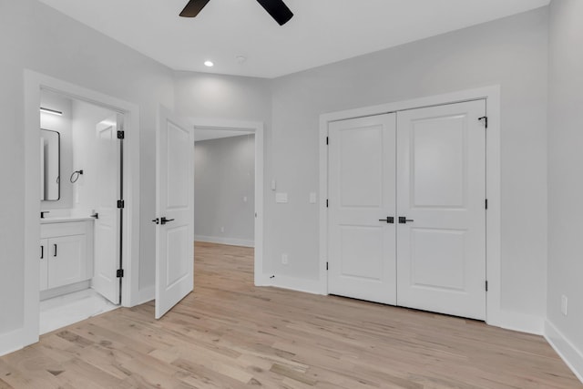 6376A Ivy St, Nashville, TN 37209 - unfurnished bedroom featuring ceiling fan, light wood-style flooring, a closet, ensuite bath, and baseboards
