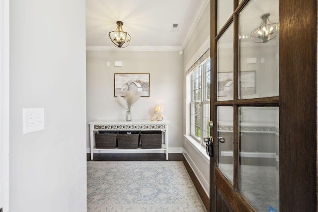 7025 Headwaters Dr, Franklin, TN 37064 - entryway featuring a chandelier, dark wood-style flooring, crown molding, and a healthy amount of sunlight